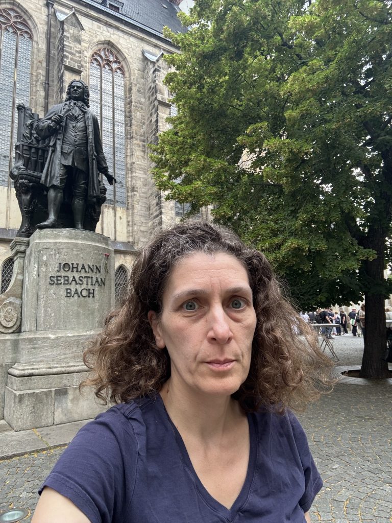 photograph of Dr. Kailan Rubinoff in front of the St. Thomas church in Leipzig, where J.S. Bach worked